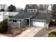 Charming gray house with a two-car garage and a well-maintained front yard at 13883 E Radcliff Pl, Aurora, CO 80015