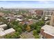 Expansive aerial view showing a cityscape with diverse buildings, trees and rooftops at 534 E 7Th Ave # 101, Denver, CO 80203