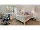 Bedroom with a window, neutral colors, and a desk area at 534 E 7Th Ave # 101, Denver, CO 80203