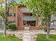 Brick building with well-maintained landscaping and sidewalks at 534 E 7Th Ave # 101, Denver, CO 80203