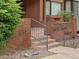 Exterior view of brick building and landscaped entry steps at 534 E 7Th Ave # 101, Denver, CO 80203
