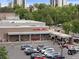 Aerial view of Trader Joe's with parking lot full of cars and people at 534 E 7Th Ave # 101, Denver, CO 80203