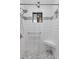 Walk-in shower with glass door, white subway tile, and built-in shower seat at 534 E 7Th Ave # 101, Denver, CO 80203