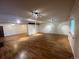 Finished basement with wood laminate floors, support beams, recessed lighting, and multiple closets at 5777 County Road 154, Elizabeth, CO 80107