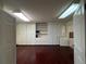 Bonus room features hardwood floors, white walls, built in storage units and shelving, and recessed lighting at 5777 County Road 154, Elizabeth, CO 80107