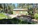 Exterior of a small building with dirt path, fenced in near forest at 5777 County Road 154, Elizabeth, CO 80107