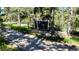 Exterior view of a building with fencing on a partially wooded lot at 5777 County Road 154, Elizabeth, CO 80107
