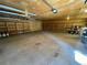 Spacious garage with lots of shelving and concrete floor at 5777 County Road 154, Elizabeth, CO 80107