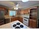 Well-lit kitchen features wooden cabinetry, a skylight, and modern appliances at 5777 County Road 154, Elizabeth, CO 80107