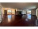 Large living room featuring hardwood floors, a stone fireplace, and multiple windows providing ample natural light at 5777 County Road 154, Elizabeth, CO 80107