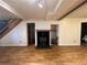 Cozy living room with a wood-burning fireplace and wooden floors at 5777 County Road 154, Elizabeth, CO 80107