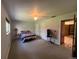 Bedroom featuring carpeted floors, fan and two large closets at 5777 County Road 154, Elizabeth, CO 80107