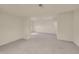Open unfinished carpeted basement featuring overhead lighting and access to other spaces at 4006 E Geddes Cir, Centennial, CO 80122