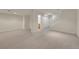 Finished carpeted basement with access to stairs and a possible storage area at 4006 E Geddes Cir, Centennial, CO 80122