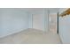 Bright bedroom with closet space, soft carpeting, and a view of the hallway leading to adjacent rooms at 4006 E Geddes Cir, Centennial, CO 80122