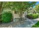Charming home featuring a covered front entrance with decorative shrubs and a stone covered yard at 4006 E Geddes Cir, Centennial, CO 80122