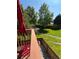 Backyard featuring a well manicured lawn, stone path, and privacy fence at 5479 E Weaver Ave, Centennial, CO 80121