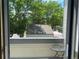Balcony with a small table overlooking lush greenery, offering a serene outdoor space at 5479 E Weaver Ave, Centennial, CO 80121