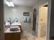 Bright bathroom showcasing double sinks, marble countertops, and a glass-enclosed shower at 5479 E Weaver Ave, Centennial, CO 80121