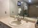 Bathroom featuring a vanity with a white sink and large mirror and tiled shower at 5479 E Weaver Ave, Centennial, CO 80121