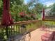 Relaxing outdoor deck featuring patio furniture, decorative plants, and views of the serene backyard at 5479 E Weaver Ave, Centennial, CO 80121