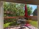 Relaxing outdoor deck featuring patio furniture, decorative plants, and views of the serene backyard at 5479 E Weaver Ave, Centennial, CO 80121