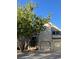 Two-story home featuring an attached two-car garage and a well-maintained front yard with a large tree at 5479 E Weaver Ave, Centennial, CO 80121