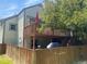 Exterior view of home's deck and patio with fenced in backyard at 5479 E Weaver Ave, Centennial, CO 80121