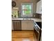 Well lit kitchen featuring stainless steel appliances, white countertops and tile backsplash at 5479 E Weaver Ave, Centennial, CO 80121