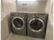 This is a laundry room that features a washer and dryer at 5479 E Weaver Ave, Centennial, CO 80121