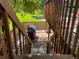 Outdoor patio with stone pavers, grill, and wooden stairs to an upper deck at 5479 E Weaver Ave, Centennial, CO 80121