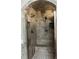 Elegant walk-in shower featuring dual shower heads, gray marble tile, and built-in bench at 5479 E Weaver Ave, Centennial, CO 80121