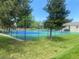 Community tennis and pickleball courts surrounded by lush green grass at 5479 E Weaver Ave, Centennial, CO 80121