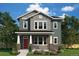 Charming two-story home with a covered front porch and beautifully landscaped yard at 21034 E 63Rd Dr, Aurora, CO 80019