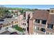 Aerial view of townhomes nestled among trees and streets at 12360 W Nevada Pl # 101, Lakewood, CO 80228