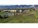 Community with school, athletic field, and the foothills in the background at 12360 W Nevada Pl # 101, Lakewood, CO 80228