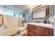 Bathroom with modern vanity, tiled backsplash, tub, and wood look flooring at 12360 W Nevada Pl # 101, Lakewood, CO 80228