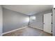Cozy bedroom featuring neutral tones, carpet, and a bright window at 12360 W Nevada Pl # 101, Lakewood, CO 80228