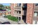 Exterior shot of building with balconies, stairs, and attractive landscaping at 12360 W Nevada Pl # 101, Lakewood, CO 80228