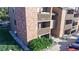 Condo building exterior with multiple units, private balconies, and street parking at 12360 W Nevada Pl # 101, Lakewood, CO 80228
