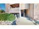 Condo exterior with balconies, brick and siding, plus a walkway and landscaping at 12360 W Nevada Pl # 101, Lakewood, CO 80228