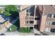 Building exterior with balconies and stairs, surrounded by lush landscaping at 12360 W Nevada Pl # 101, Lakewood, CO 80228