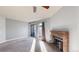 Well-lit living room featuring a brick fireplace and sliding doors to the outside at 12360 W Nevada Pl # 101, Lakewood, CO 80228