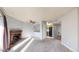Inviting living room with brick fireplace and a view into the adjacent kitchen at 12360 W Nevada Pl # 101, Lakewood, CO 80228