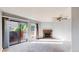 Bright living room with sliding glass doors and a cozy brick fireplace at 12360 W Nevada Pl # 101, Lakewood, CO 80228