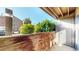 Outdoor patio with wood accents and lush greenery at 12360 W Nevada Pl # 101, Lakewood, CO 80228