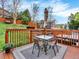 Back deck with an outdoor dining area and views of the backyard at 9774 Burberry Way, Highlands Ranch, CO 80129