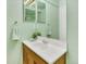 Well-lit bathroom features a mirrored vanity and modern fixtures at 9774 Burberry Way, Highlands Ranch, CO 80129