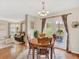 Light filled dining area with backyard access and view to living area at 9774 Burberry Way, Highlands Ranch, CO 80129