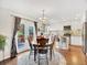 Spacious dining area open to the kitchen with french doors leading to outdoor deck at 9774 Burberry Way, Highlands Ranch, CO 80129